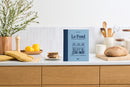 French cookbook, Le Fond: Lessons from a Neighborhood Bistro, in kitchen.