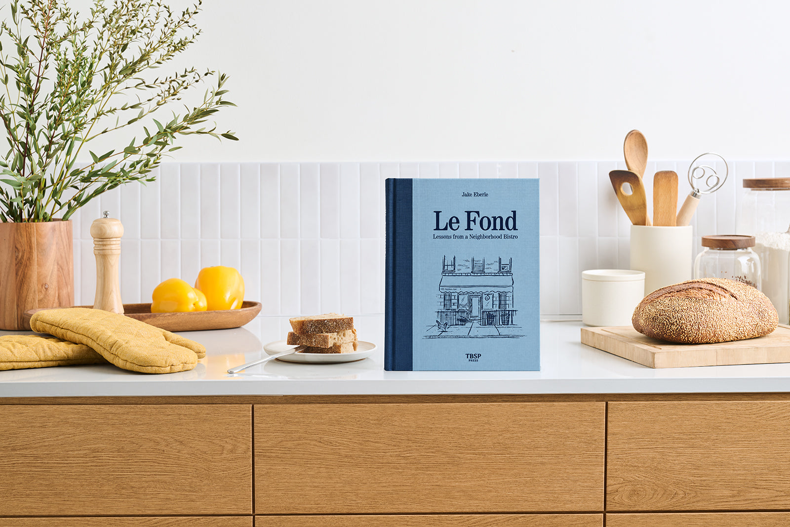 French cookbook, Le Fond: Lessons from a Neighborhood Bistro, in kitchen.